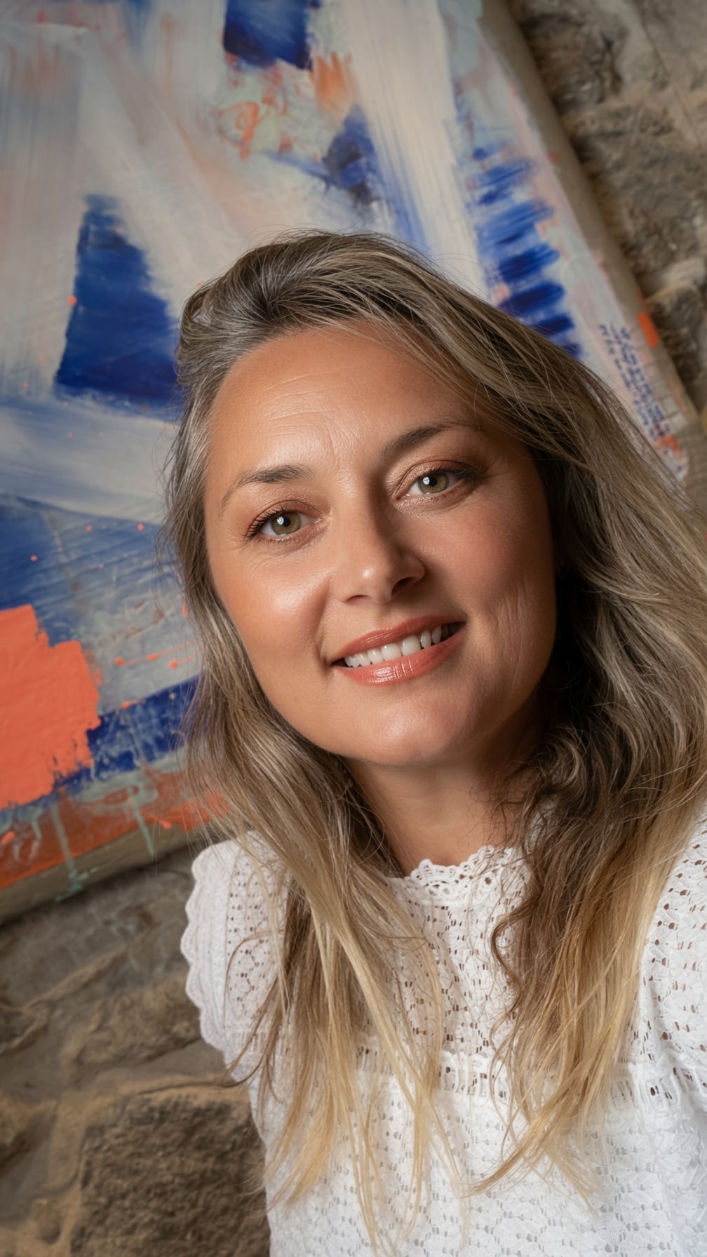 Lilou Aurélie H in front of her paintings